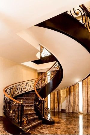 indoor curved stairs in a home in san jose