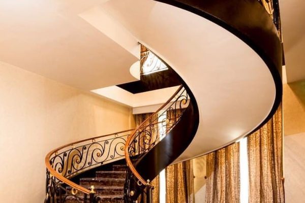 indoor curved stairs in a home in san jose